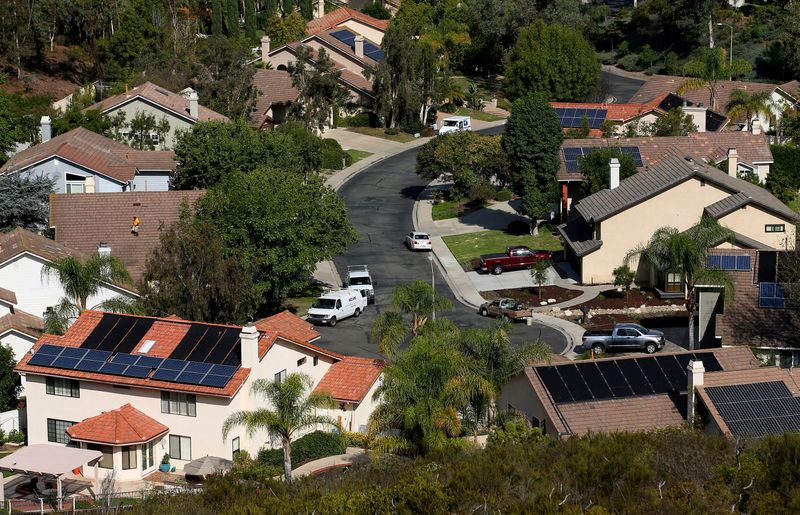 FILE PHOTO: Multiple homes with solar panels are shown in