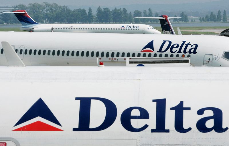 FILE PHOTO: Delta Airlines sit at Reagan National Airport outside