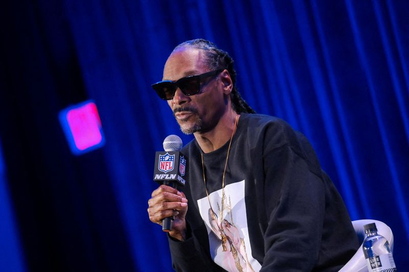 Rapper Snoop Dogg speaks during a news conference in Los