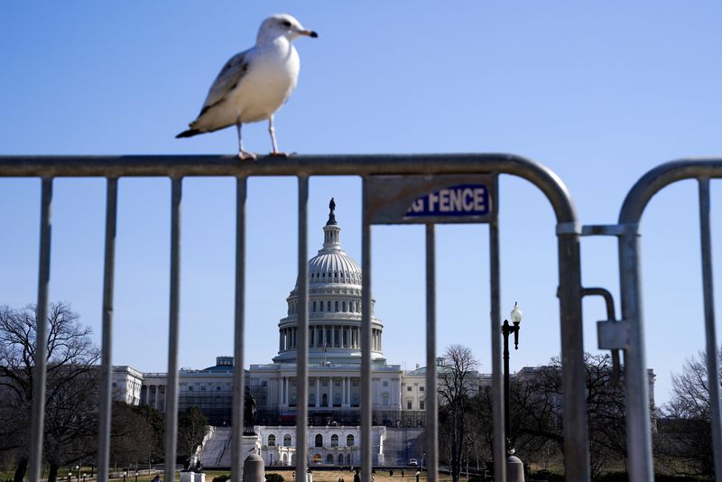 U.S. Capitol is seen through a barricade, in Washington