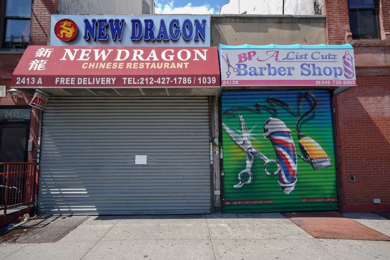 FILE PHOTO: A Chinese restaurant and barber shop in Harlem