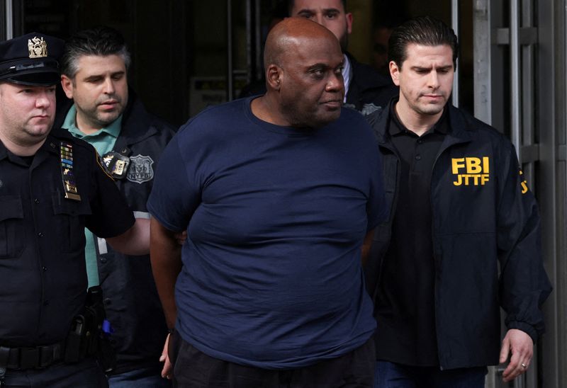 Frank James, the suspect in the Brooklyn subway shooting walks
