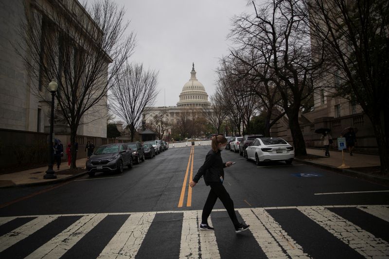 A visitor uses a crosswalk near the Longworth House Office