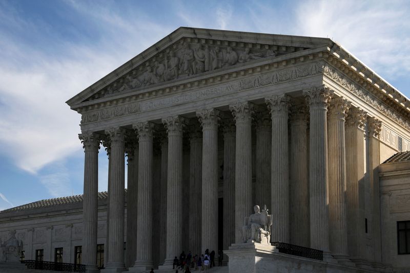 FILE PHOTO: People visit the U.S. Supreme Court building in