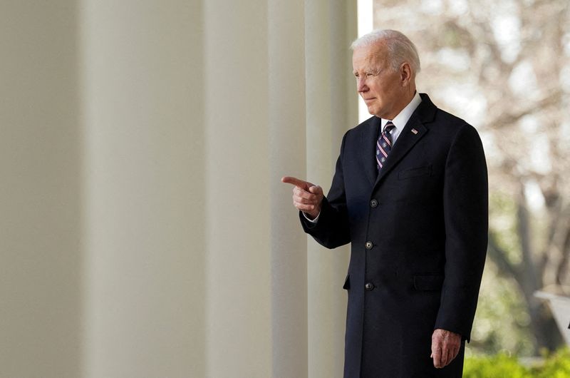FILE PHOTO: U.S. President Joe Biden enters the Rose Garden