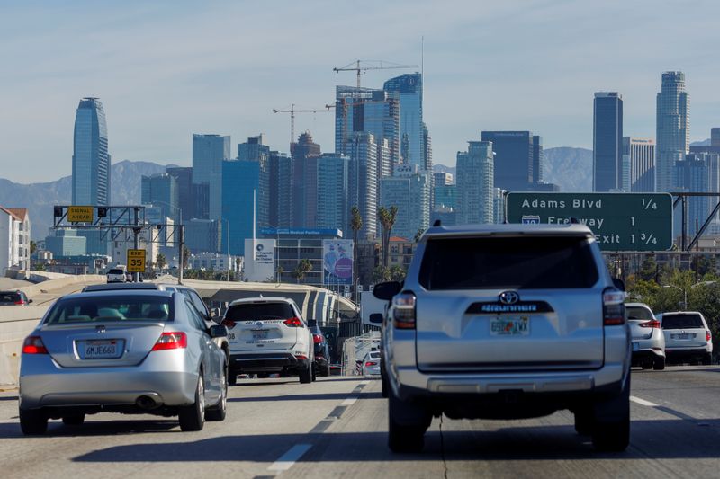Traffic moves along a freeway as vehicles travel towards Los