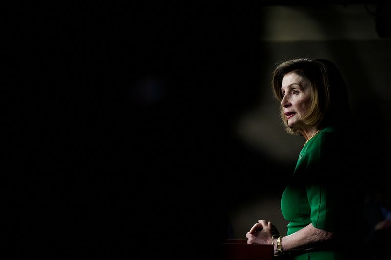 FILE PHOTO: U.S. House Speaker Nancy Pelosi (D-CA) holds her
