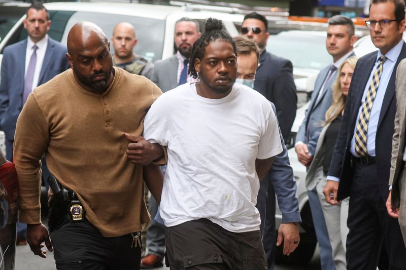 New York Subway shooting suspect Andrew Abdullah is escorted by