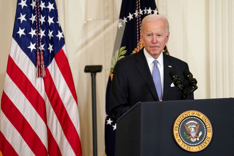 U.S. President Joe Biden signs an executive order to reform