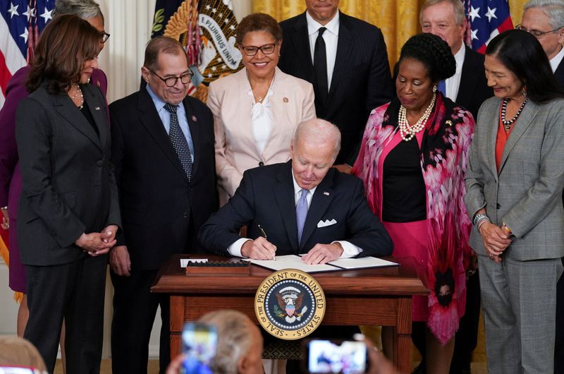 U.S. President Joe Biden signs an executive order to reform