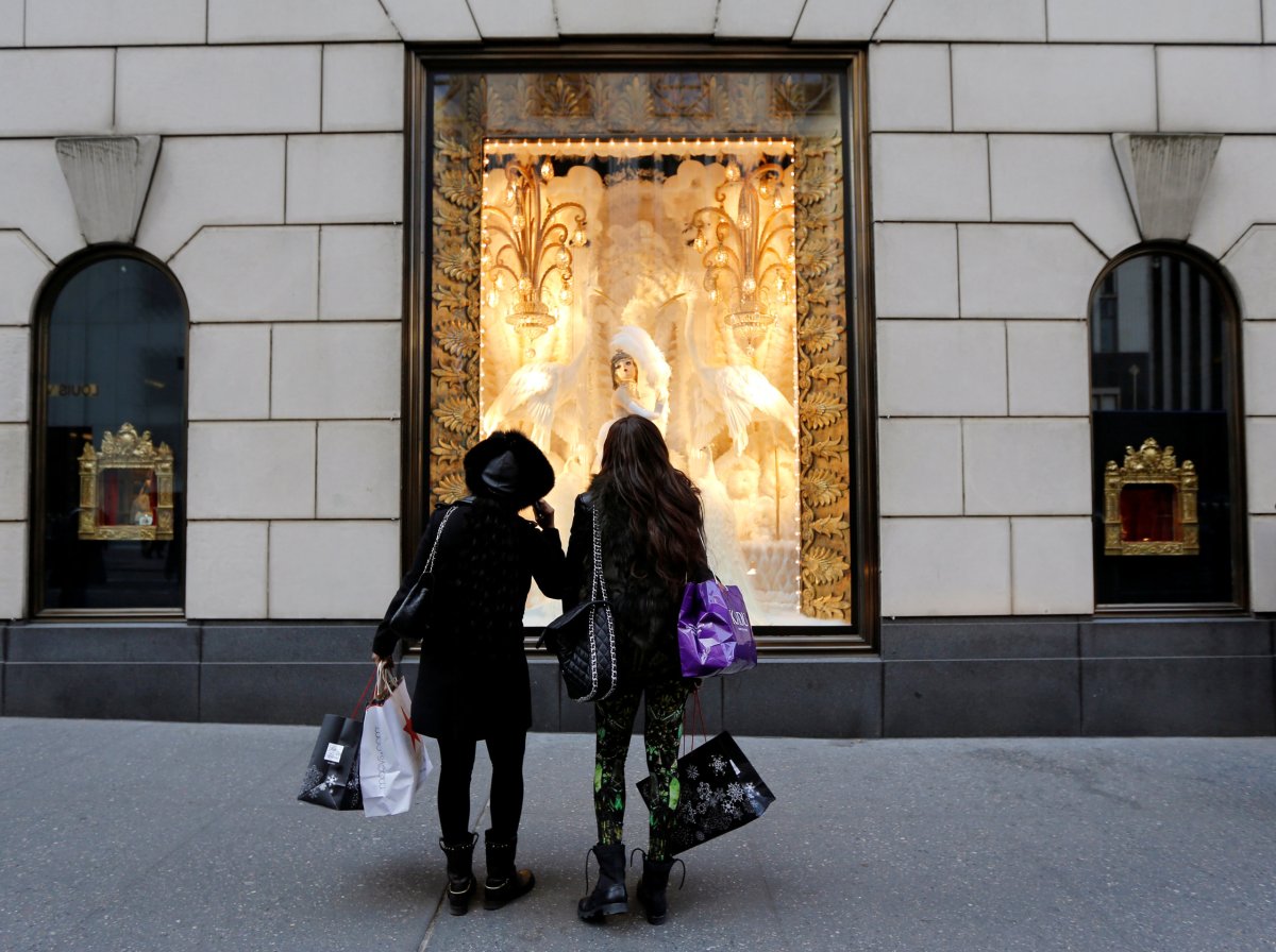 Holiday shoppers look at store windows at Henri Bendel store