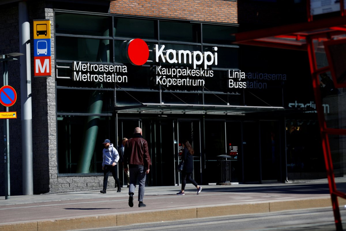 FILE PHOTO: People walk next to the Kamppi underground station