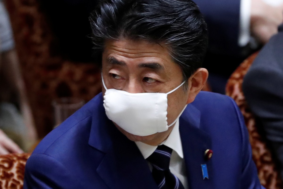 Japan’s Prime Minister Shinzo Abe wears a protective face mask