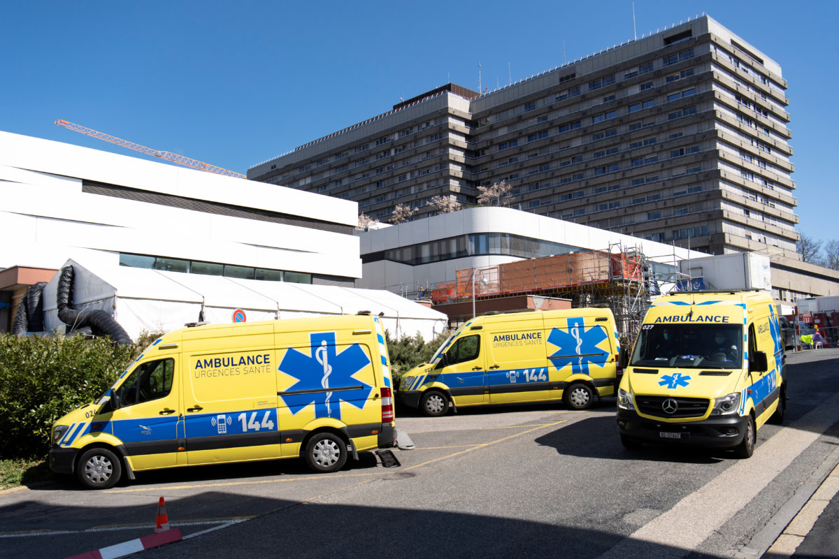 Ambulances are pictured in front of a temporary space for