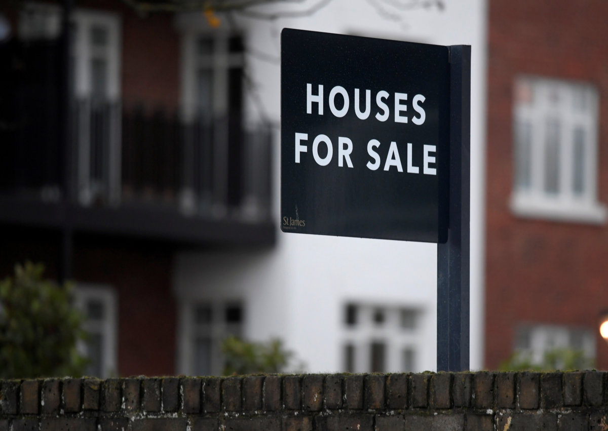 FILE PHOTO: Property sale signs are seen outside of a