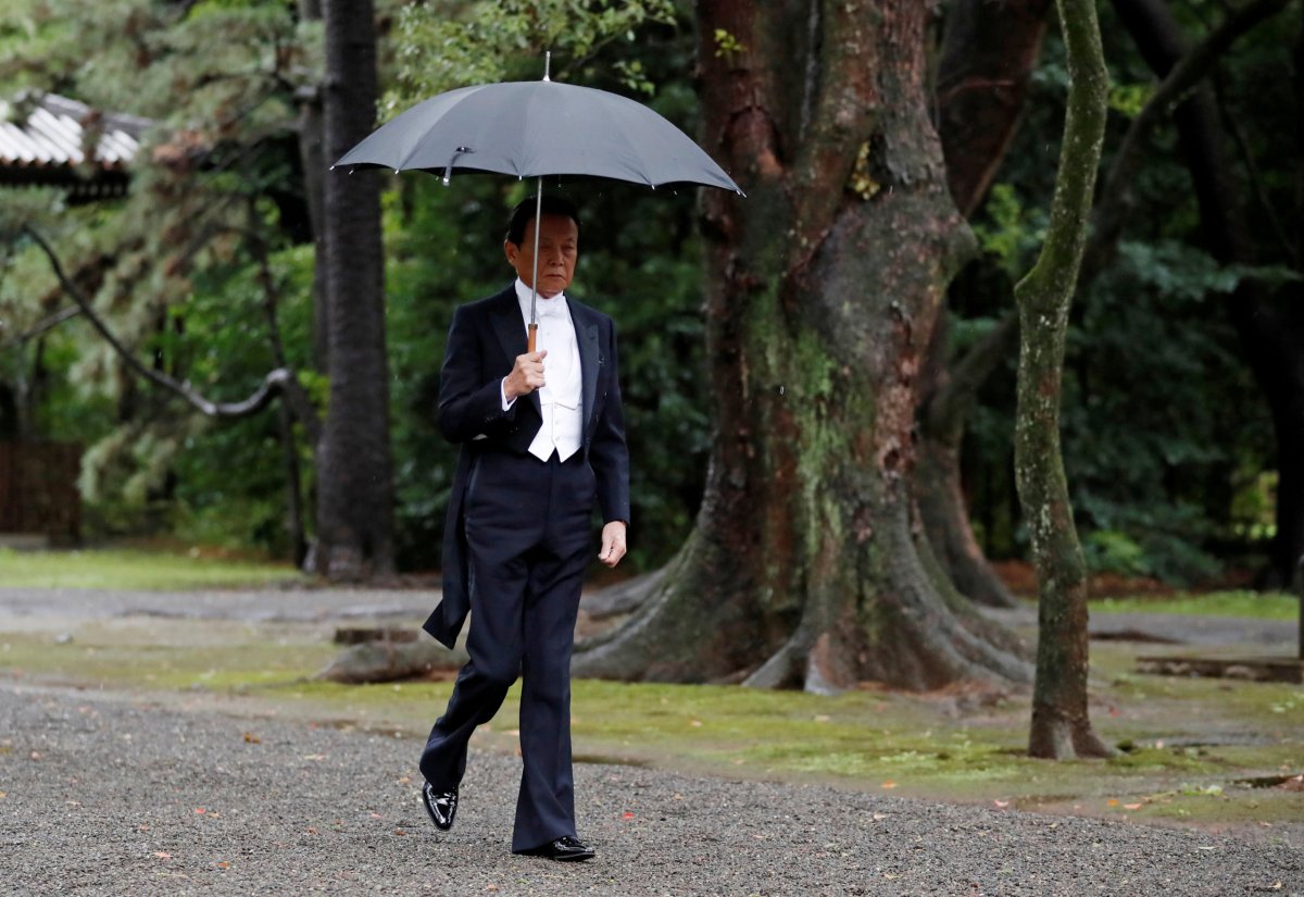 Japan’s Finance Minister Taro Aso arrives at the ceremony site