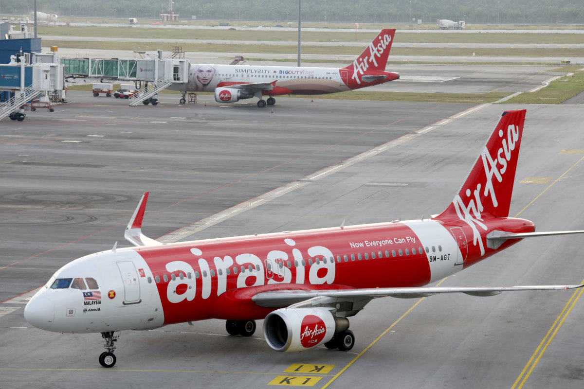 AirAsia planes are seen on the tarmac of Kuala Lumpur