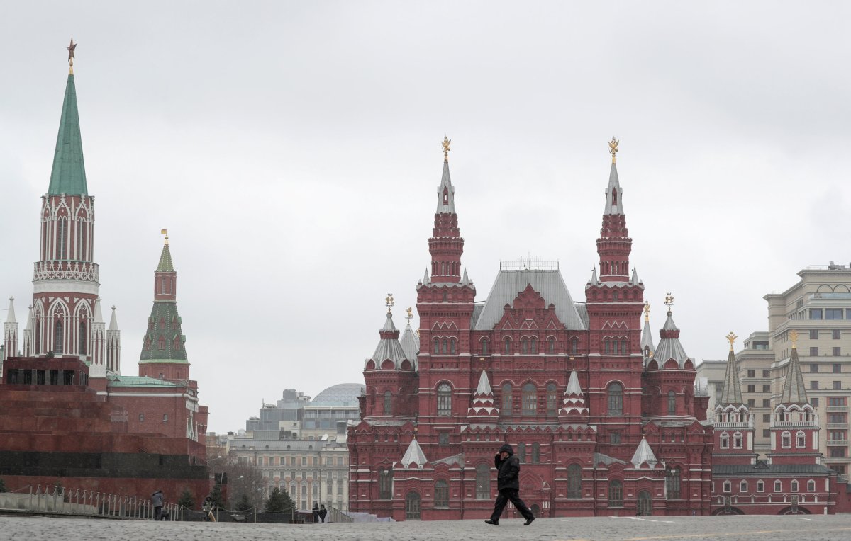 FILE PHOTO: A man crosses Red Square in Moscow