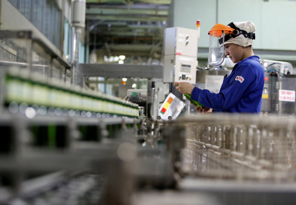Employee works at Japanese brewer Kirin Holdings’ factory in Toride,