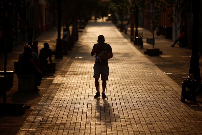 A man walks down Regina Street amid the outbreak of