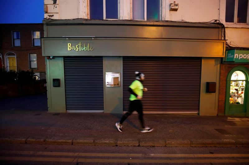 A runner jogs past the shuttered Bastible restaurant, after it