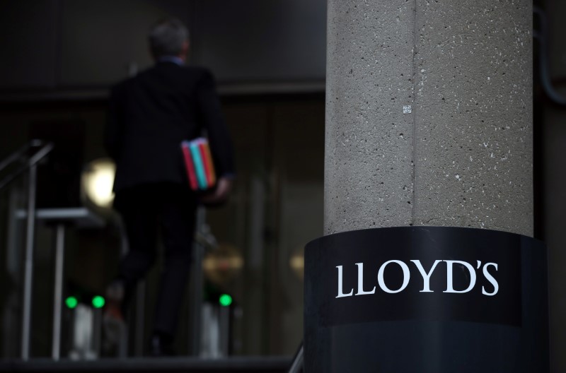 Man enters the Lloyd’s of London building in the City