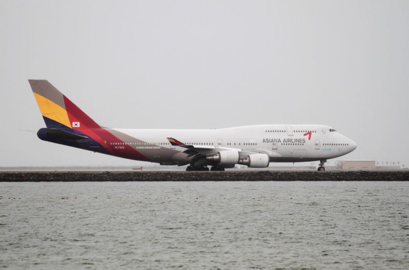 FILE PHOTO: An Asiana Airlines Boeing 747-400 taxis at San
