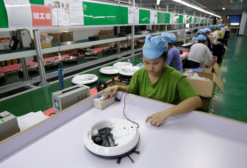 FILE PHOTO: An employee works on the production line of