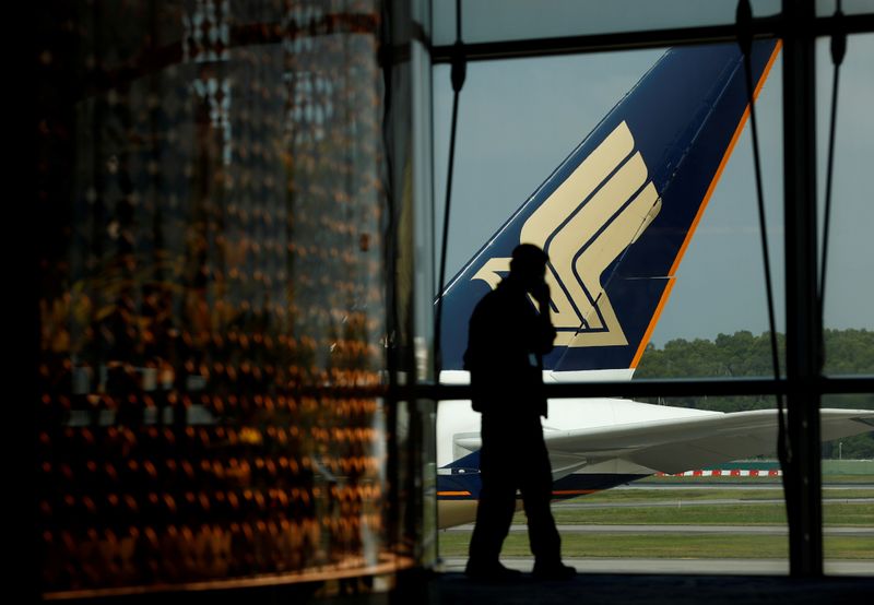 FILE PHOTO: A Singapore Airlines plane sits on the tarmac