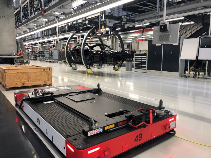 Automated vehicles carry parts for building Porsche Taycan electric cars