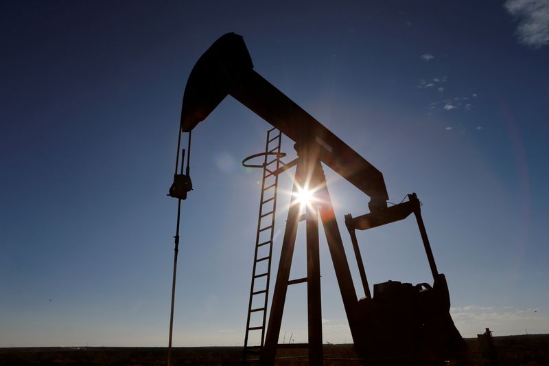 FILE PHOTO: The sun is seen behind a crude oil