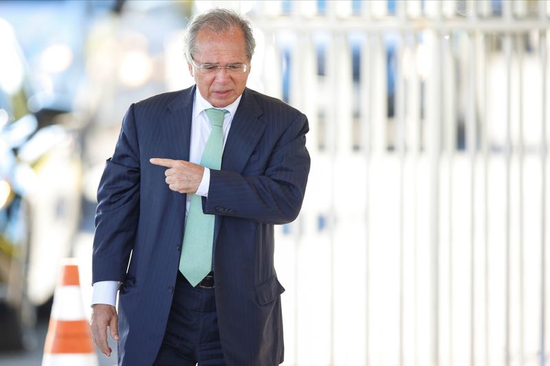 FILE PHOTO: Brazil’s Economy Minister Paulo Guedes gestures while leaving