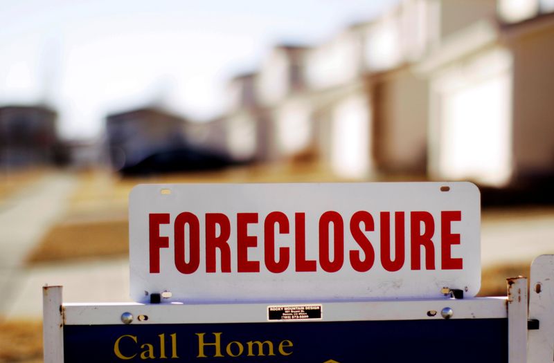 FILE PHOTO: The sign for a foreclosed house for sale