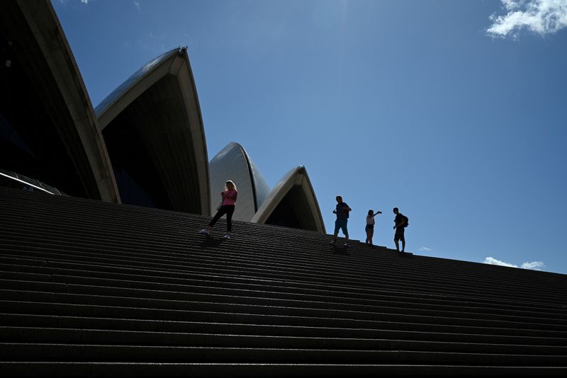 FILE PHOTO: A handful of tourists stand atop the mostly