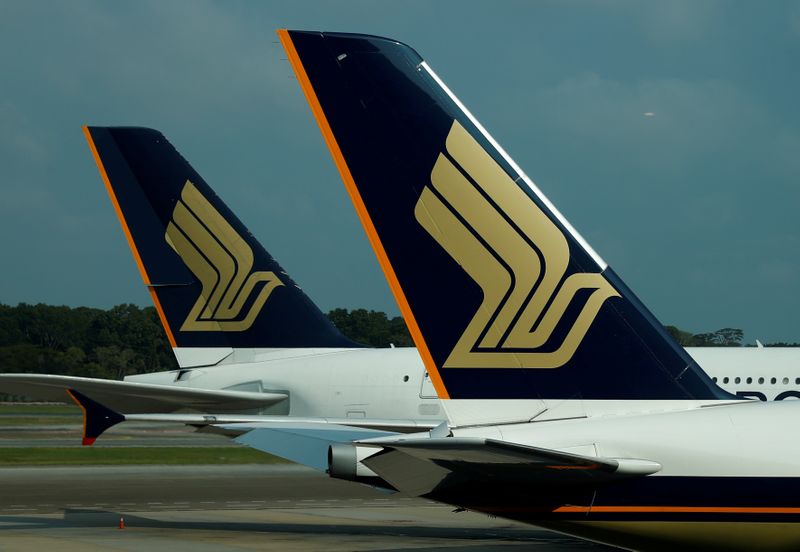 FILE PHOTO: Singapore Airlines planes sit on the tarmac at