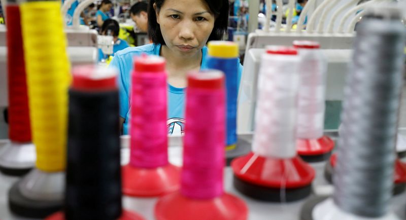 FILE PHOTO: A woman works at Maxport garment company in