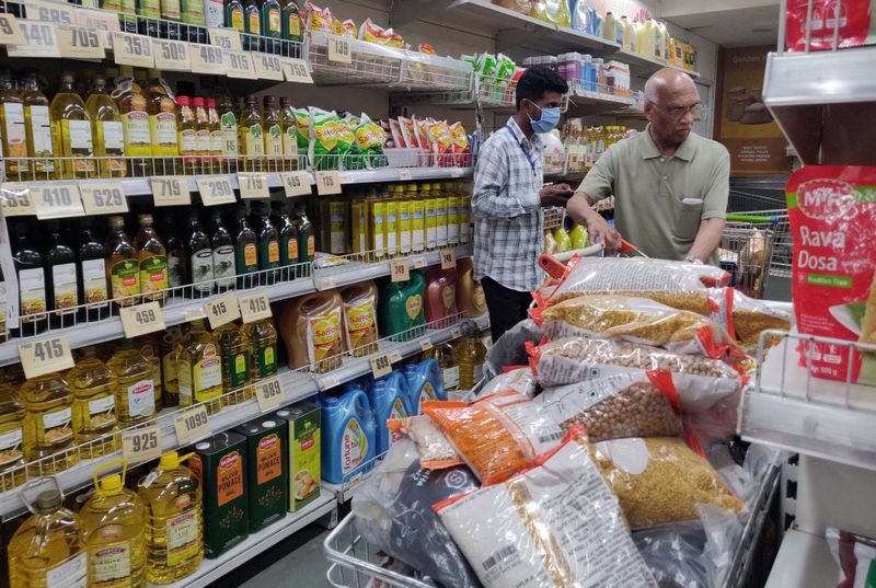 People buy grocery items at a departmental store amid coronavirus