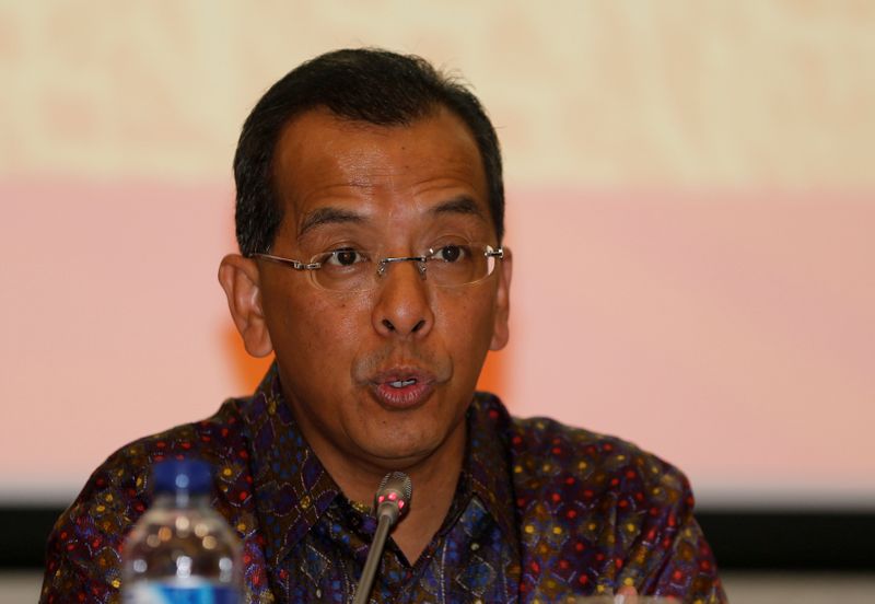 FILE PHOTO: Former Garuda Indonesia CEO Emirsyah Satar talks to