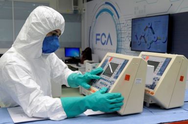 FILE PHOTO: A technician from FCA (Fiat Chrysler Automobiles) assembly