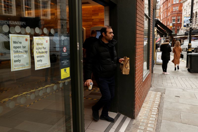 A man leaves a McDonald’s restaurant in London