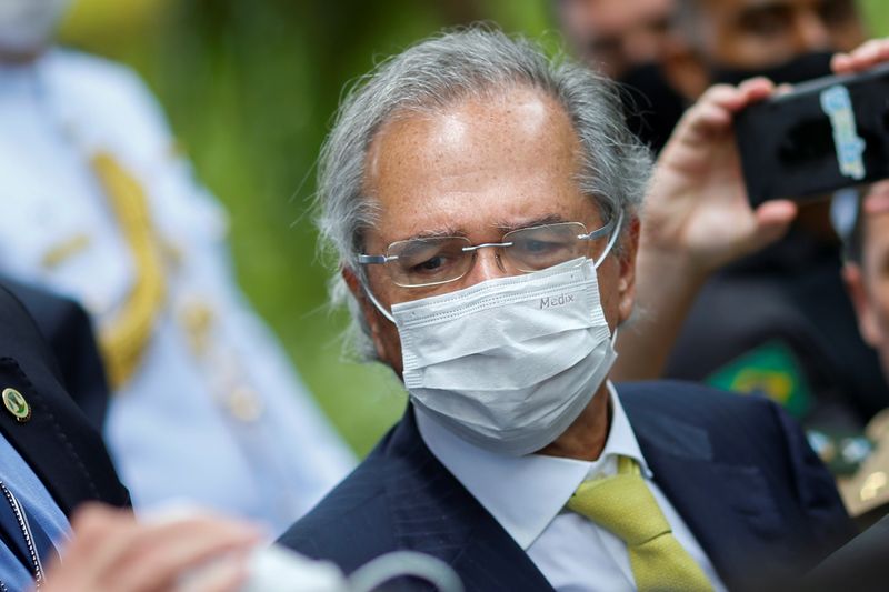 Brazil’s Economy Minister Paulo Guedes wears a protective mask during