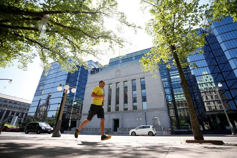 FILE PHOTO: A jogger runs past the Bank of Canada