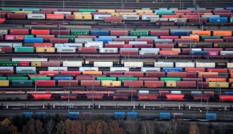 Containers are loaded on freight trains at the railroad shunting