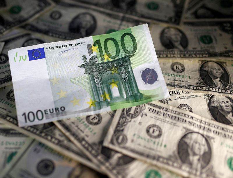 FILE PHOTO: U.S. dollar and Euro notes are seen in