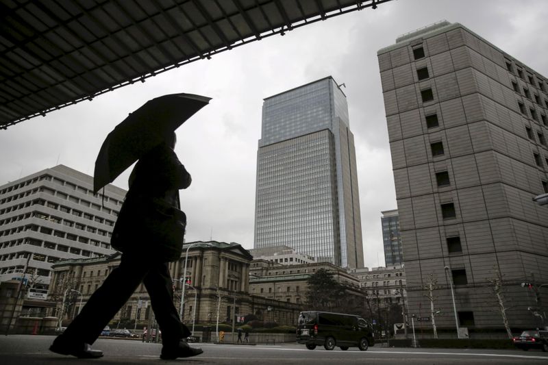 File photo of a businessman walking near Bank of Japan