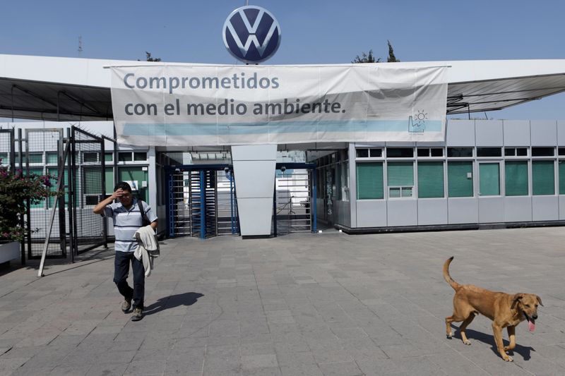 FILE PHOTO: An employee leaves the Volkswagen (VW) plant as