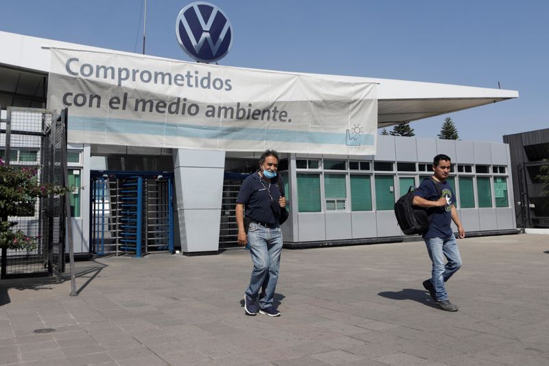 FILE PHOTO: Employees leave the Volkswagen (VW) plant as the