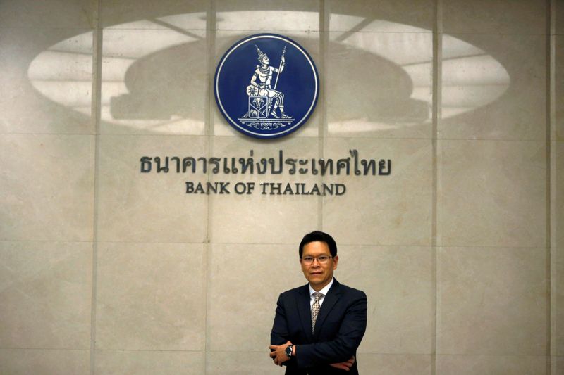FILE PHOTO: Thailand’s Central Bank Governor Veerathai Santiprabhob poses with