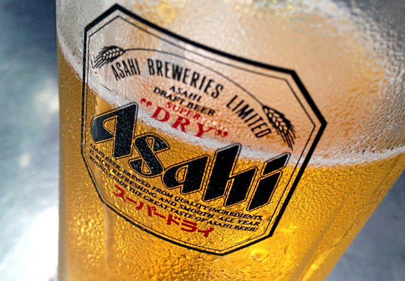 FILE PHOTO: Condensation collects on a glass of Asahi beer