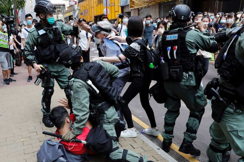 FILE PHOTO: Anti-government demonstrators scuffle with riot police during a